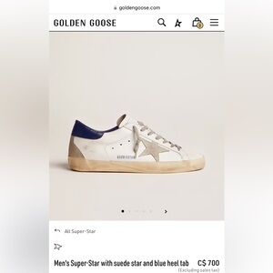 Golden Goose Men's Super-Star with suede star and blue heel tab. Essentially New